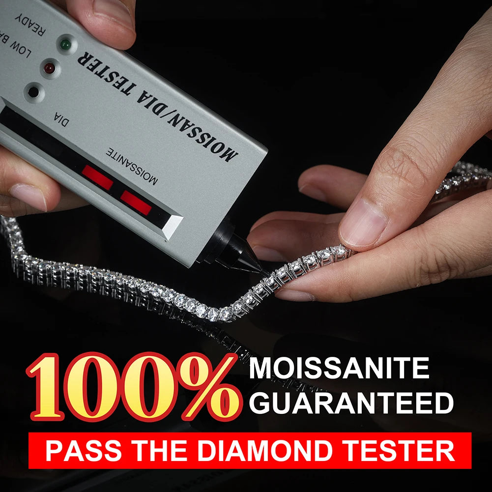 Moissanite necklace held between two hands with a diamond tester against a black background
