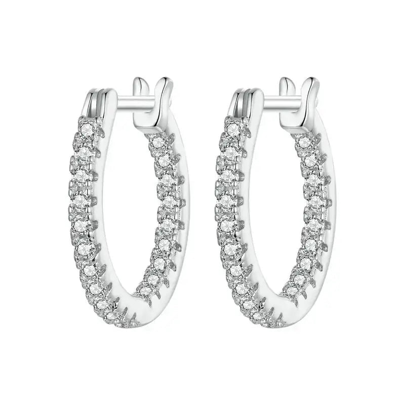 Pair of silver hoop earrings with diamond accents on a white background