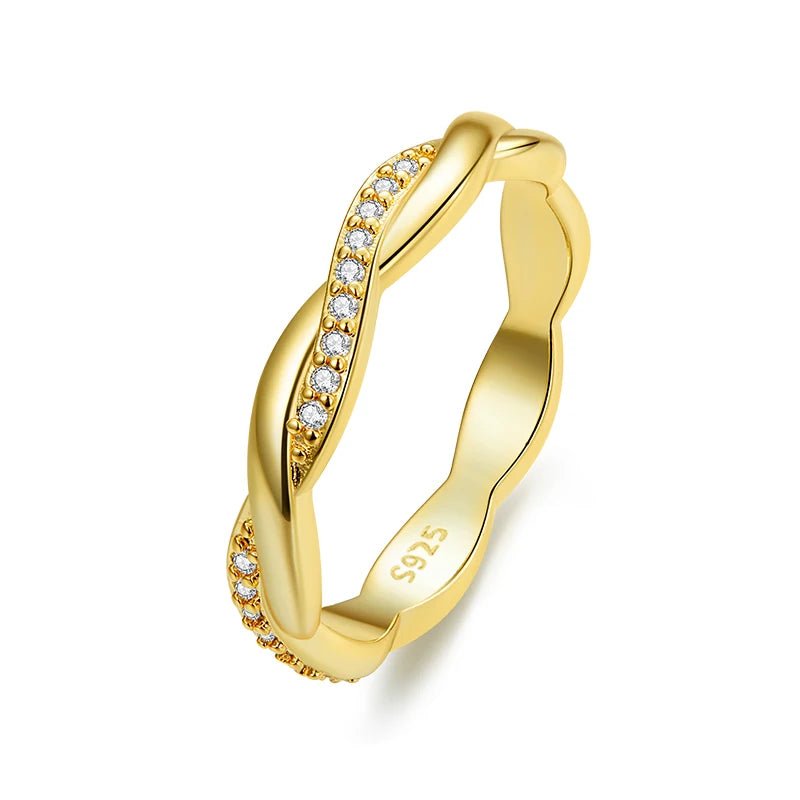 Gold ring with diamond accents on a white background