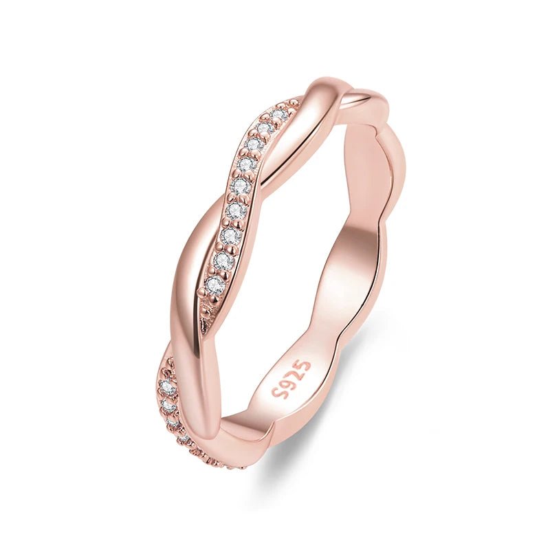 Rose gold ring with diamonds on a white background