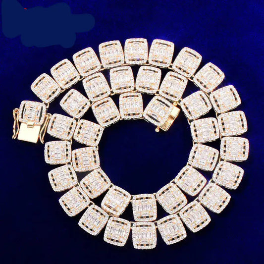 A gold-plated tennis chain necklace with baguette-cut cubic zirconia set in a linked chain design.