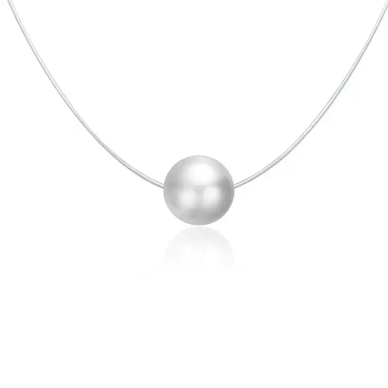 A silver invisible chain necklace with a Round-shaped pendant adorned with cubic zirconia.
