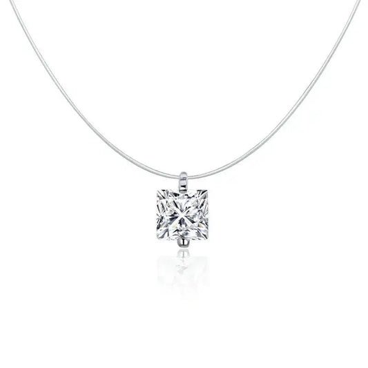 A classic princess-cut diamond solitaire pendant necklace on a delicate silver chain, shown against a clean white background with a soft reflection below.