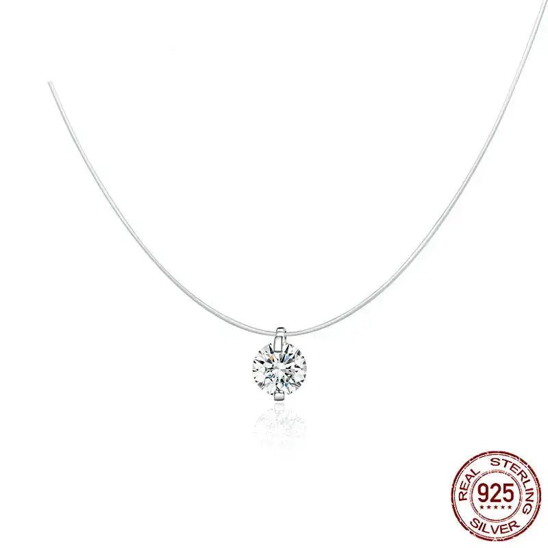 A delicate sterling silver necklace with a single round-cut clear gemstone pendant, displayed on a clean white background with a 925 sterling silver seal in the bottom right corner.