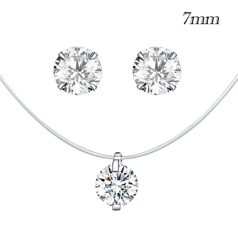 Set of silver jewelry with round gemstones on a white background